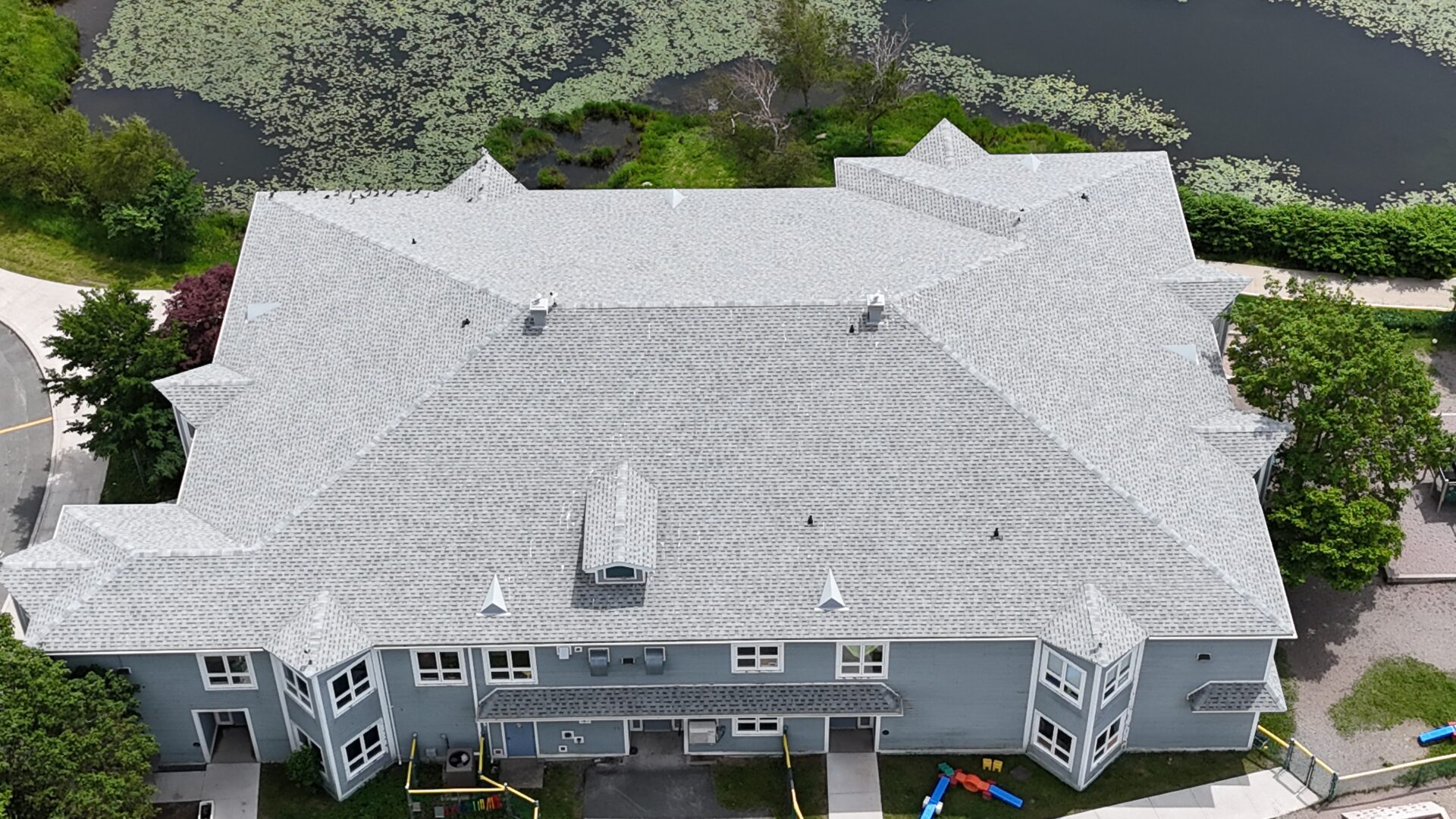 MUN Child Care 2 Overhead perspective of a substantial building featuring a prominent roof structure
