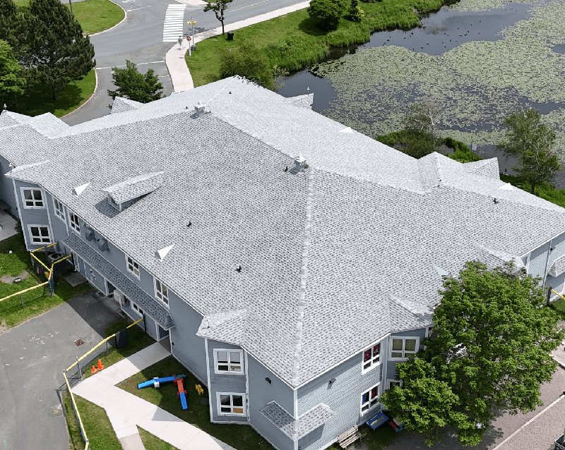 Overhead perspective of a substantial building featuring a prominent roof structure Overhead perspective of a substantial building featuring a prominent roof structure
